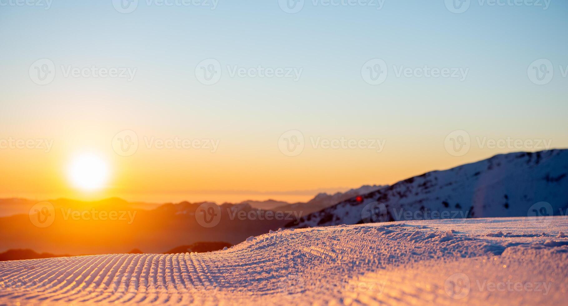 Freshly groomed ski slope photo