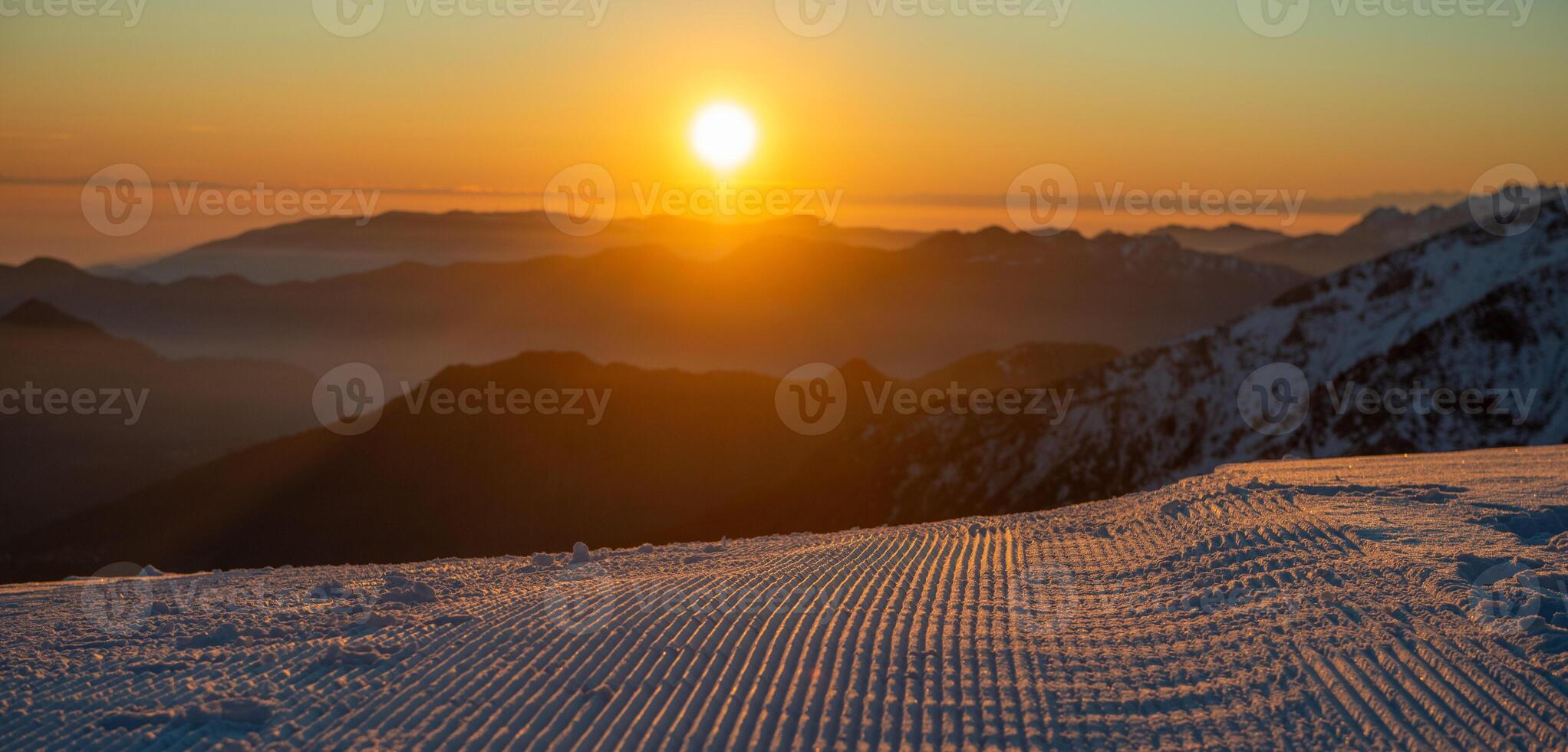 Freshly groomed ski slope photo