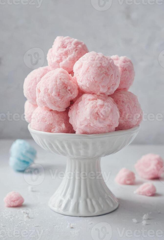 ai generado suave rosado bola de nieve dulces en elegante monitor foto