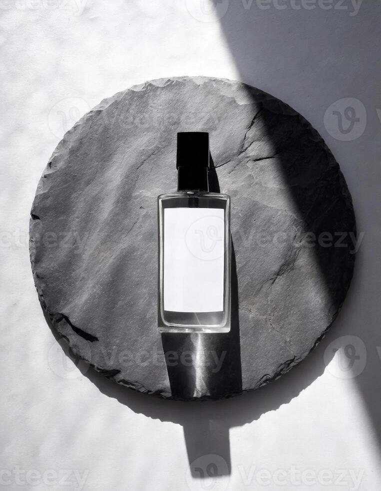 Mockup of galss transparent perfume bottle on stone plate and shadows photo