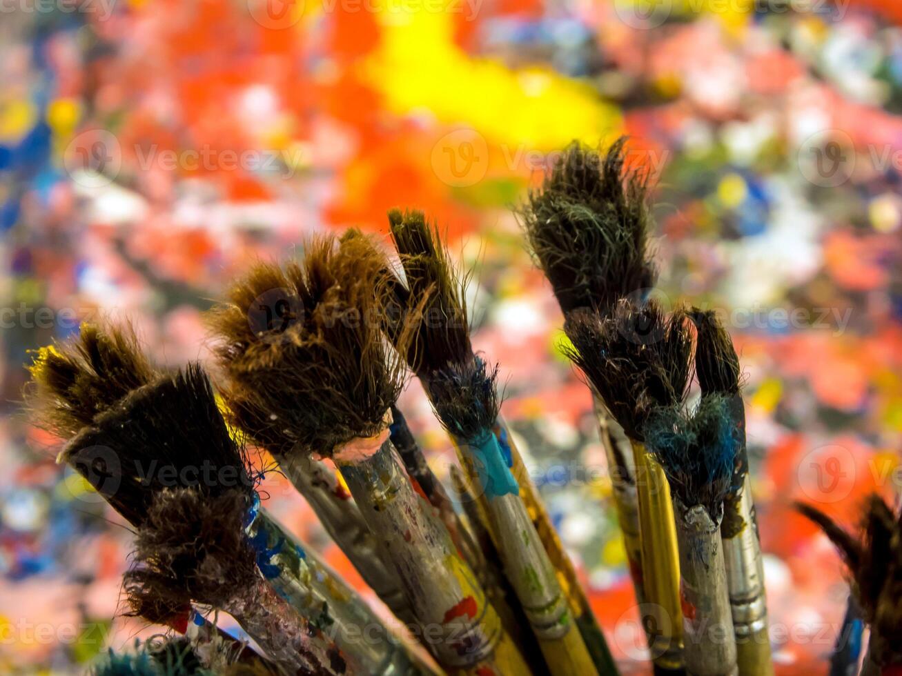 Old paintbrush on art work table photo