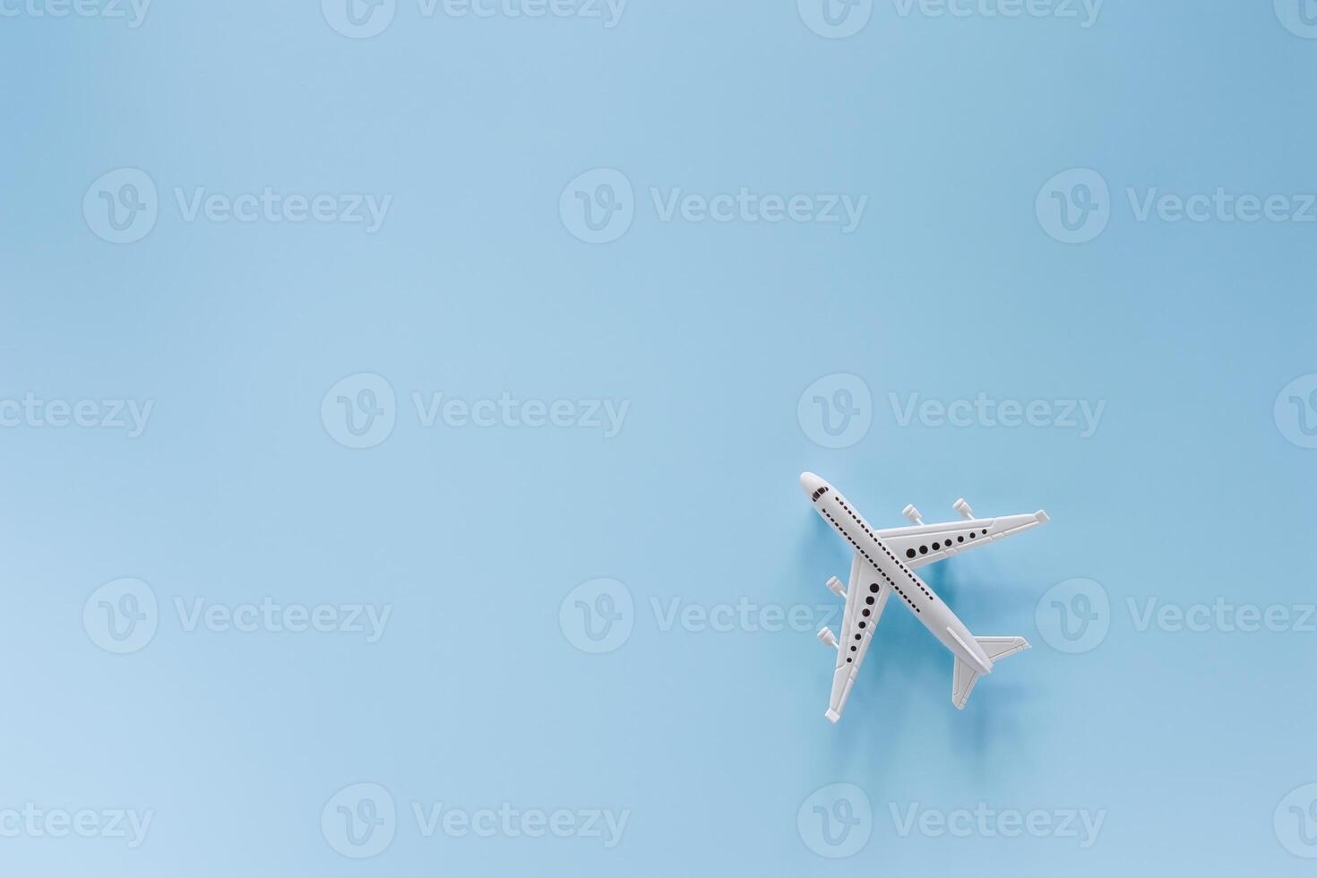 White airplane model on blue background photo