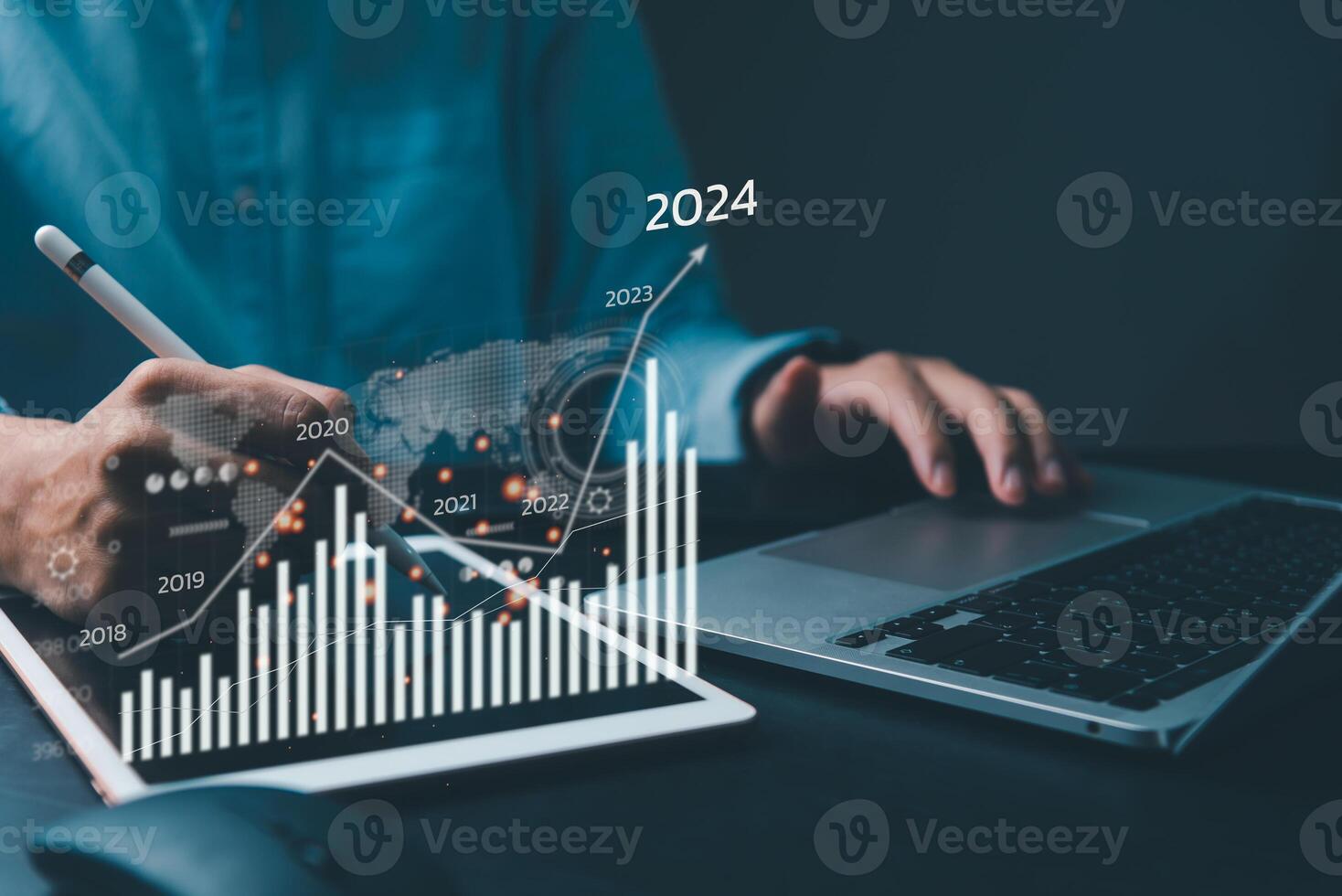 financial charts and graph analysis marketing showing growing revenue In 2024 floating above digital screen tablet, business about strategy for growth and success. photo