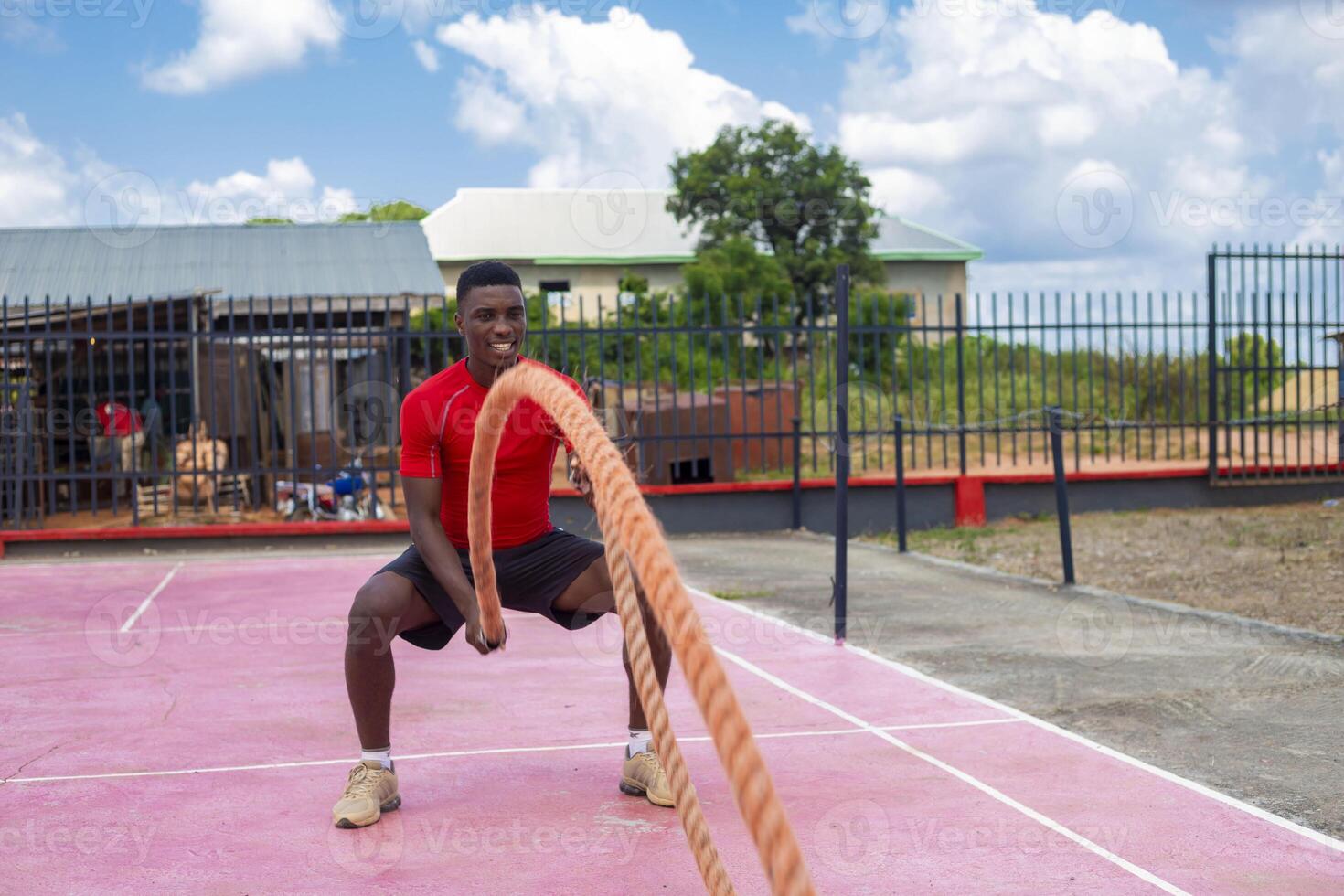 Men with battle rope battle ropes exercise in the fitness gym. CrossFit concept. gym, sport, rope, training, athlete, workout, exercises concept photo