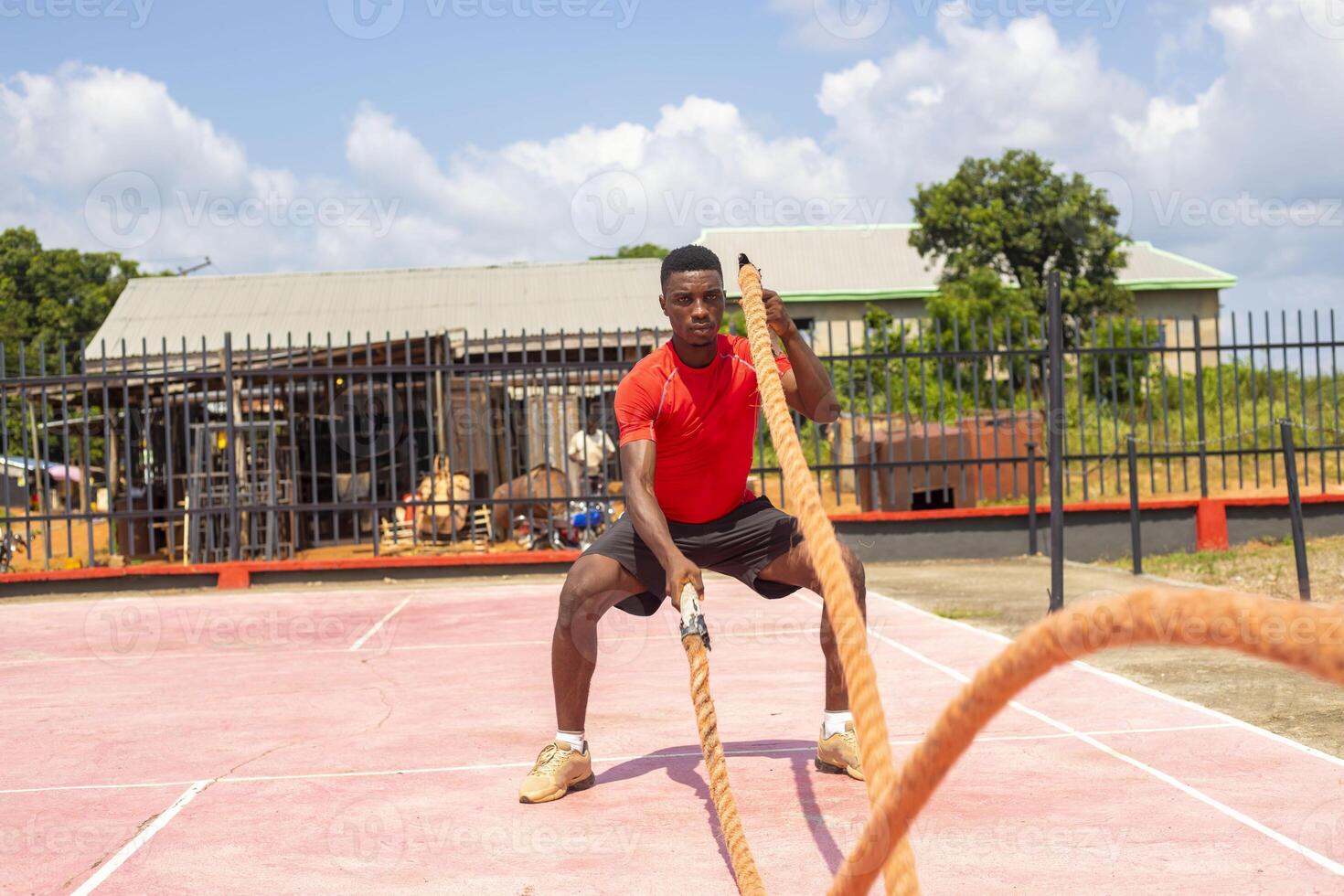 Athletic handsome african man doing cross-training photo