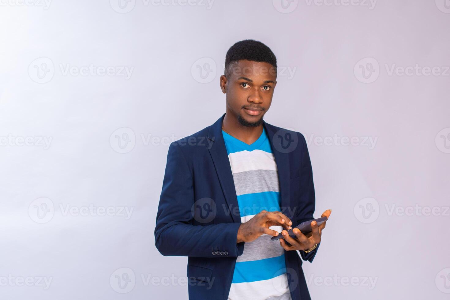 focused man using calculator isolated over white background photo