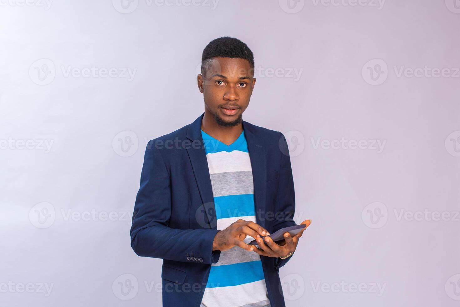focused man using calculator isolated over white background photo