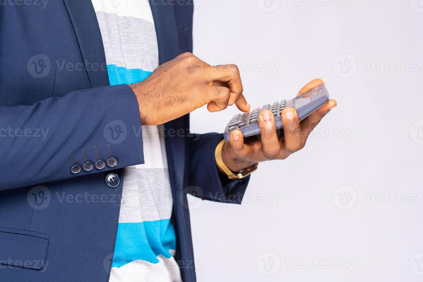 Businessman uses a calculator for calculations photo
