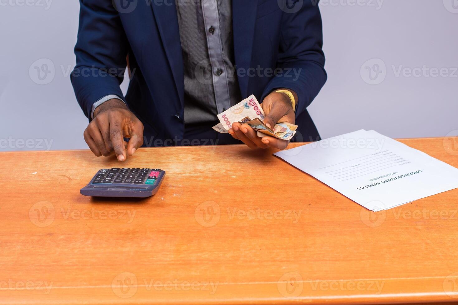 close up a business man counting and calculating money photo