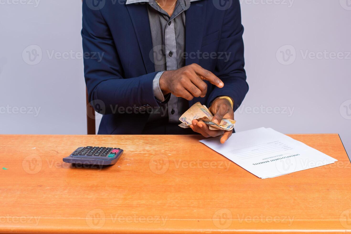 close up a business man counting and calculating money photo