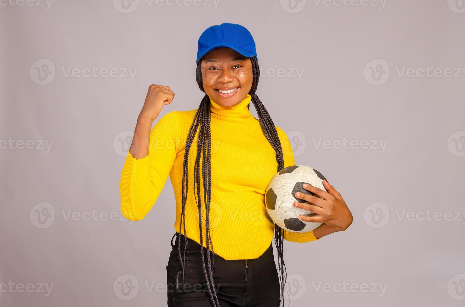 beautiful lady feeling excited as she is celebrating her team win photo