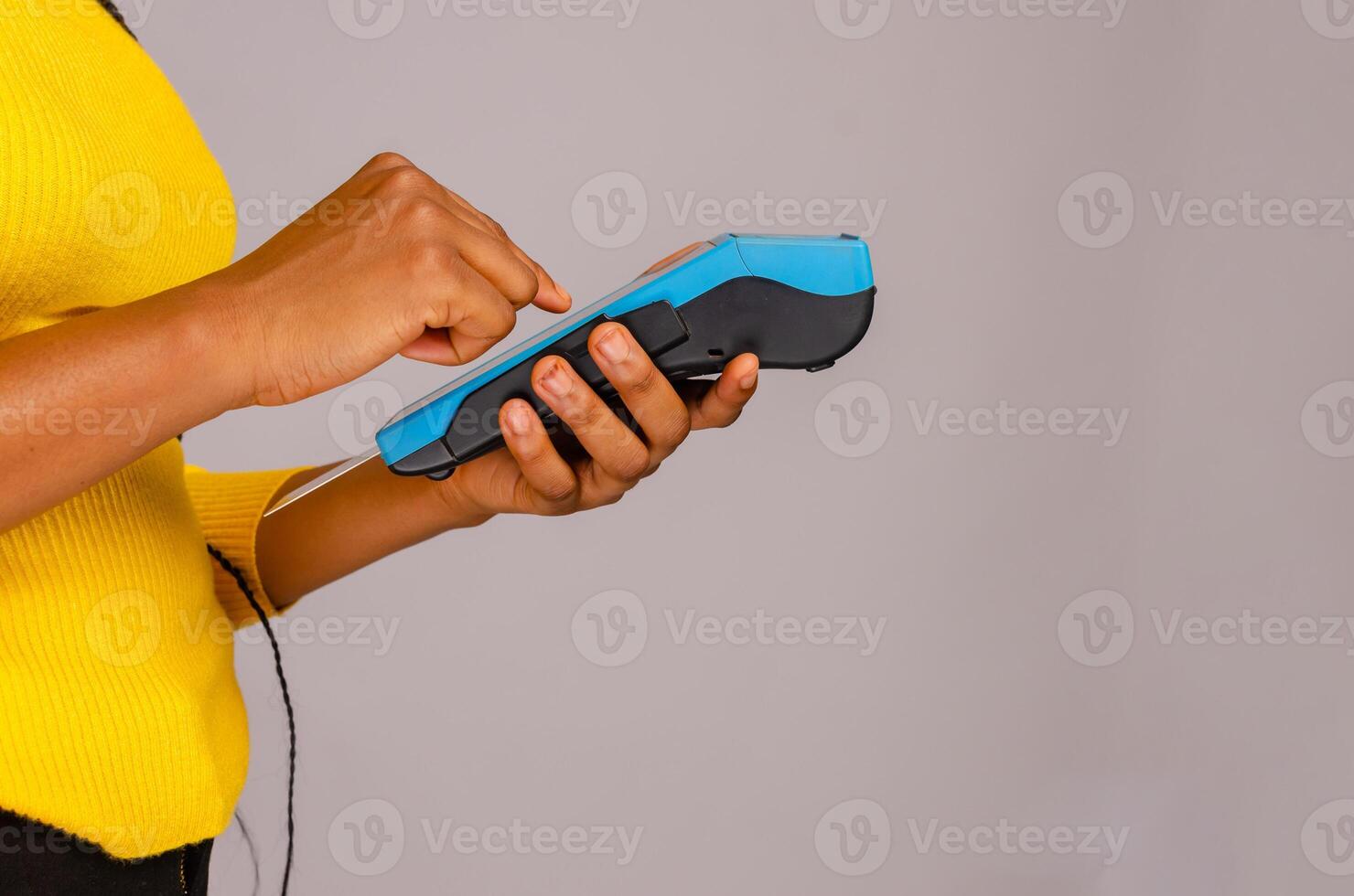 woman hand paying with smartphone on credit card point of sales terminal photo