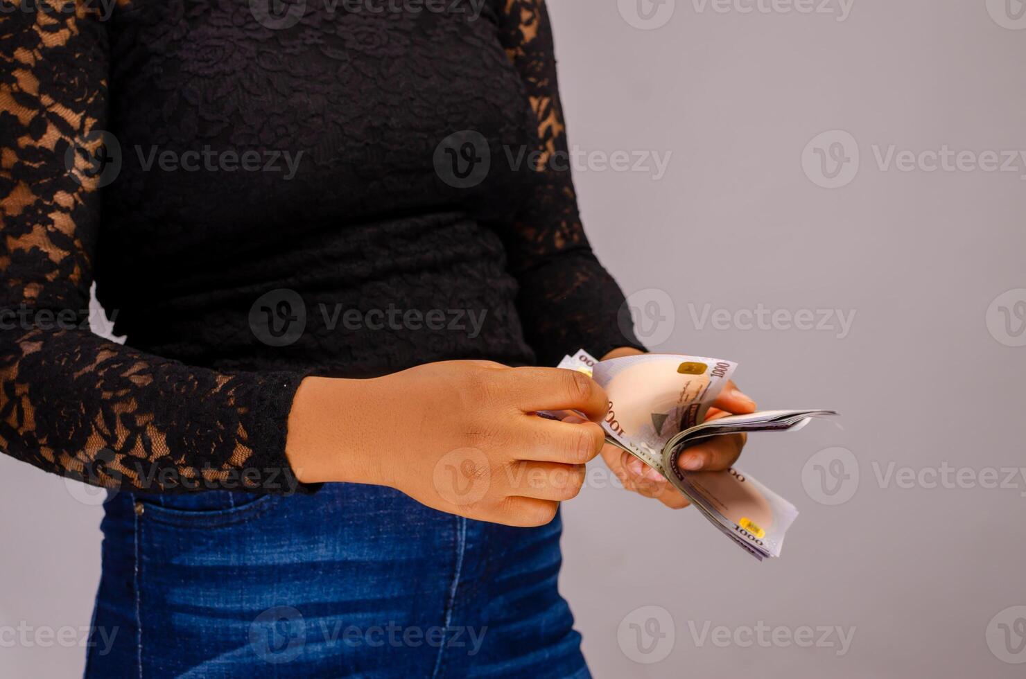 close up of a lady counting money photo