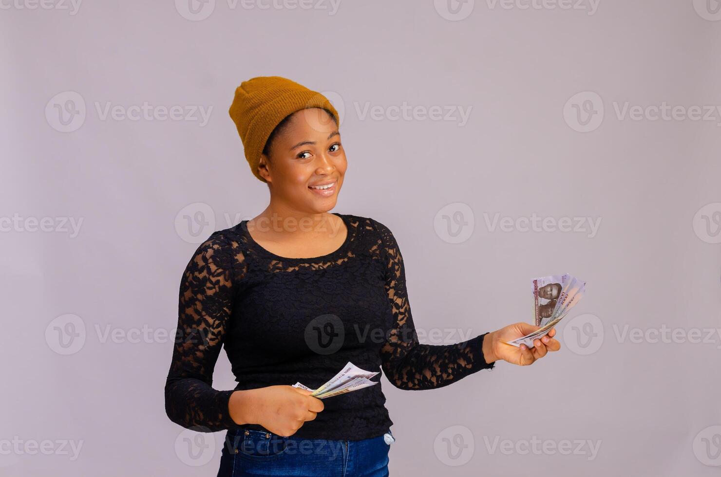 beautiful african lady happy at the money on her hand photo