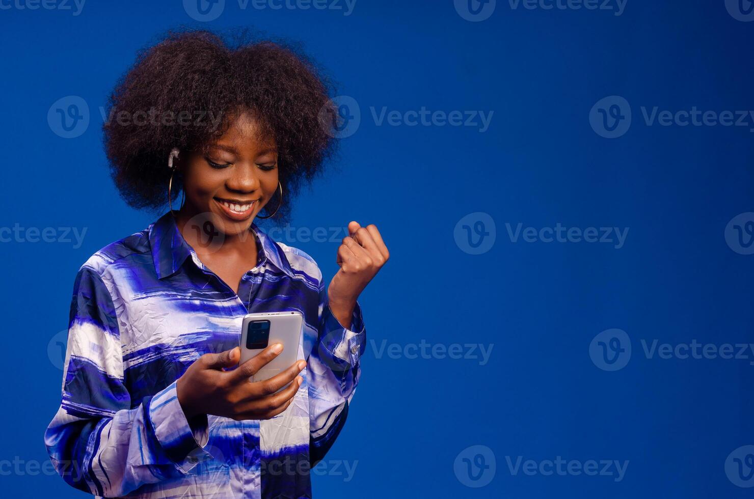 lady feeling excited about what she saw on her phone photo