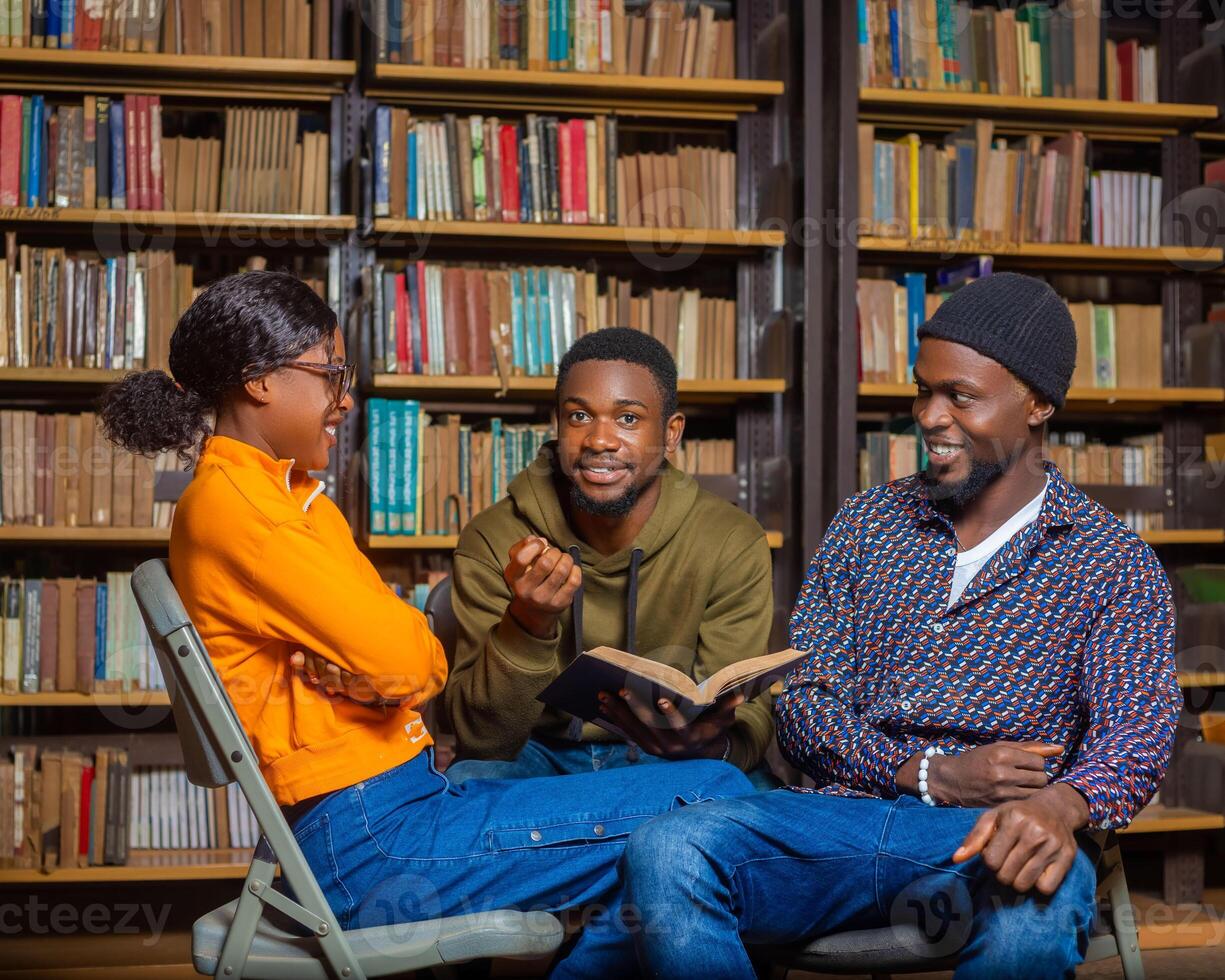 people in the library discussing about their exam photo