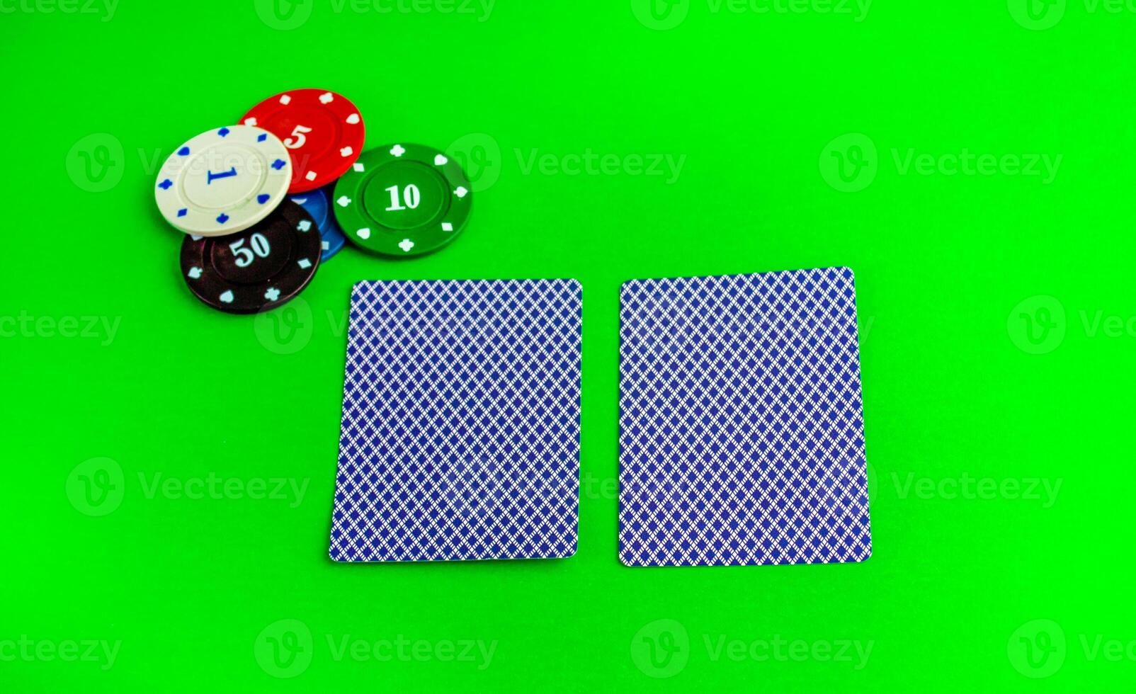 Poker game, two cards and chips. photo