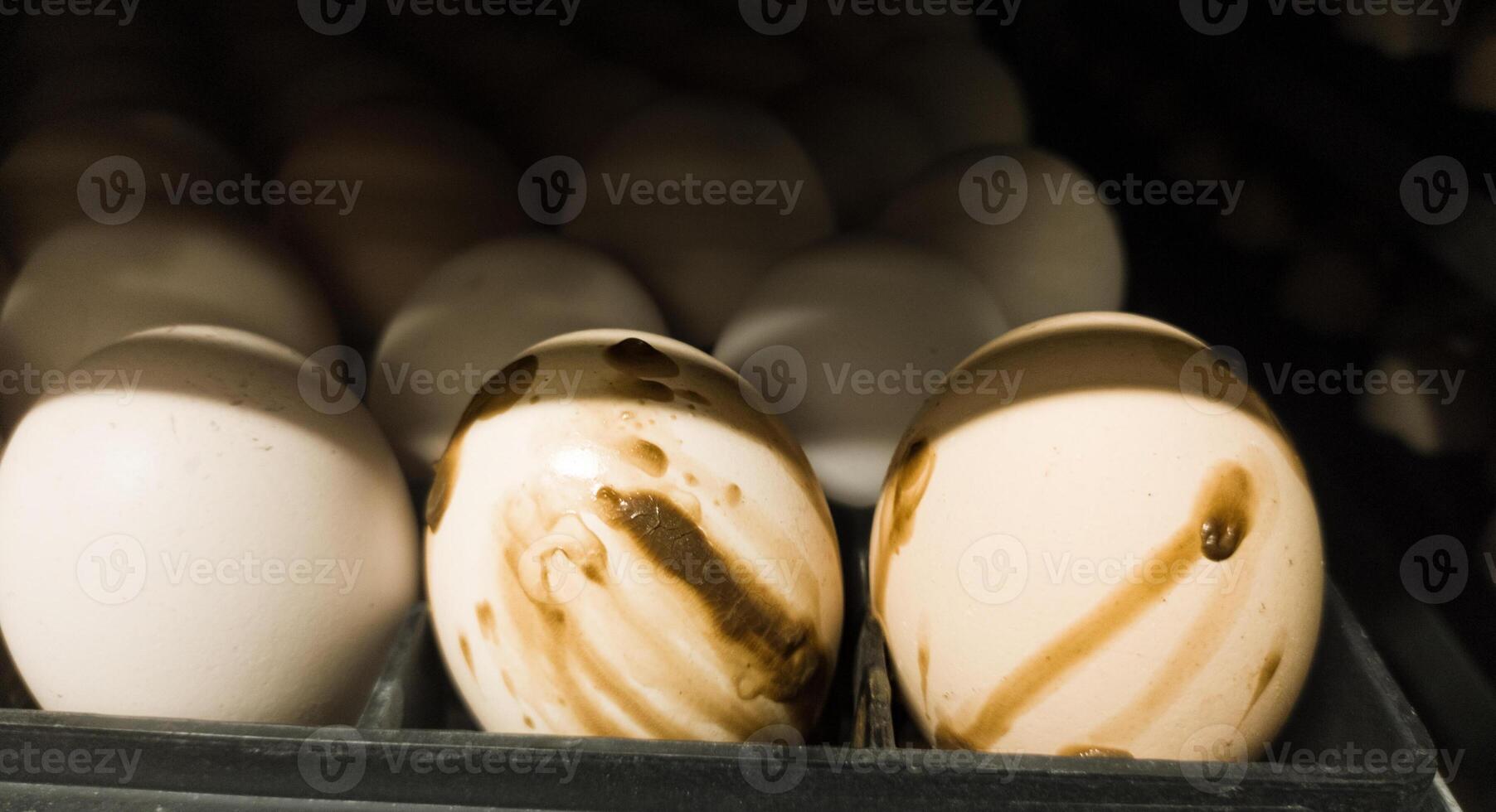 The explode eggs on the tray trolley.The egg explodes in the tray because of bacteria or fungi that enter the eggshell. Eggs explode because they are exposed to bacteria. photo