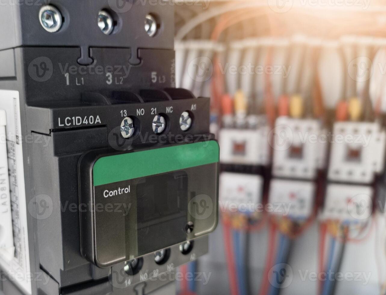 Replacement of the magnetic contactor set in the machine control panel, the concept of repairing electrical controls on machines by replacing parts. photo