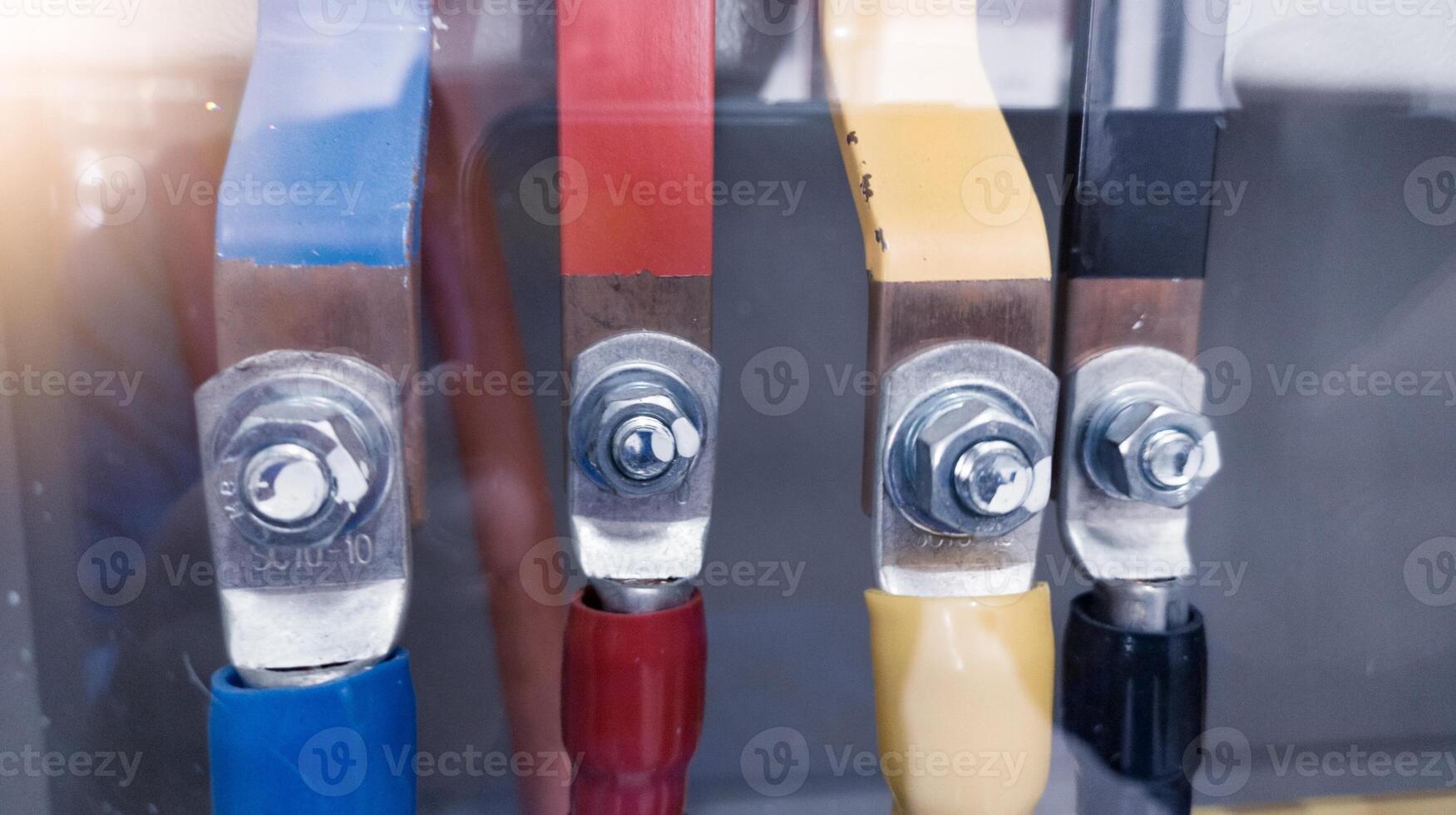 R S T Power Cables connection with copper busbars in electrical power distribution cabinet for main  power control panel. photo