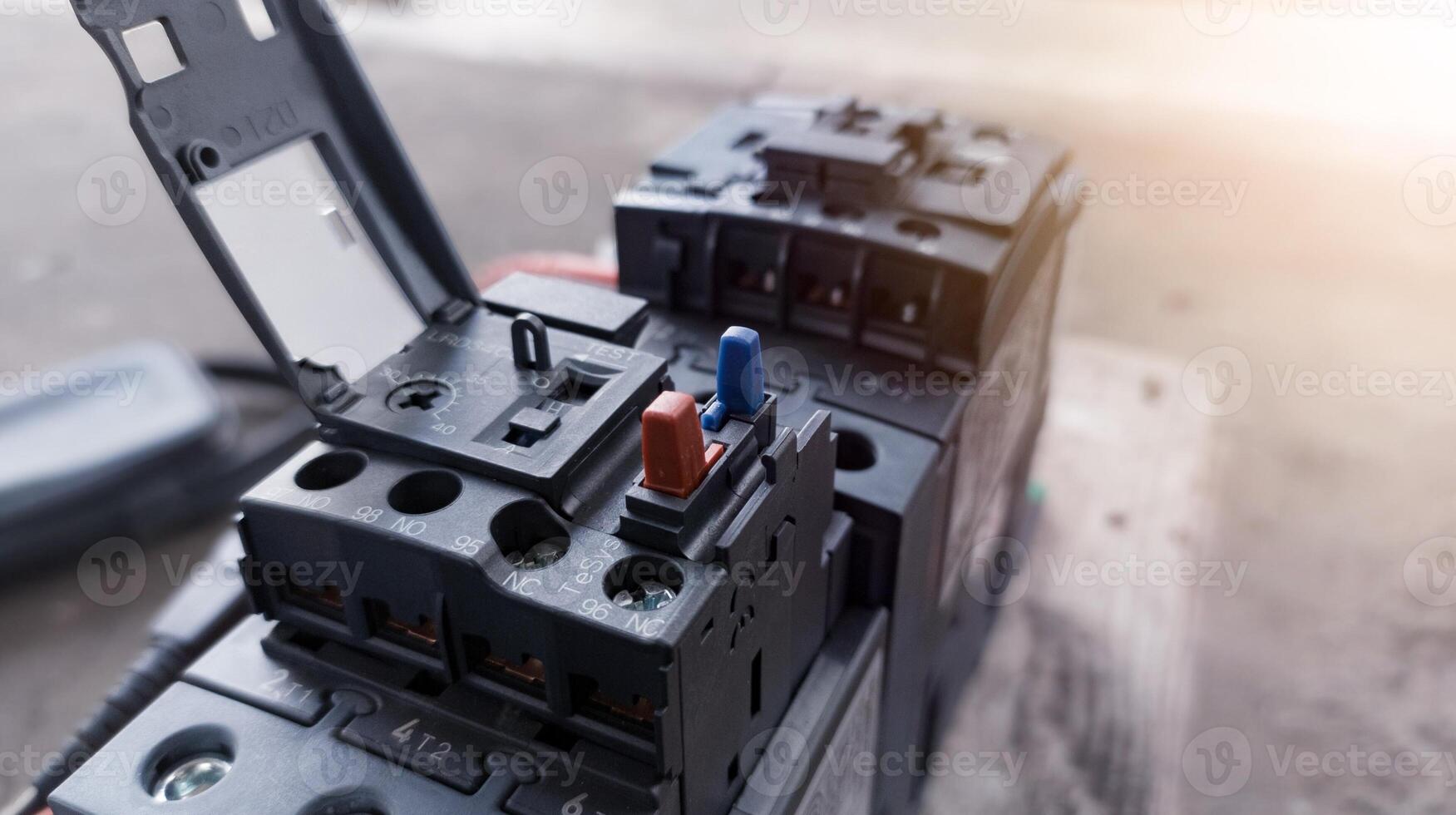 Checking magnetic contactor terminals using a multimeter, magnetic contactor electrical control components. Terminals connection wiring check. photo
