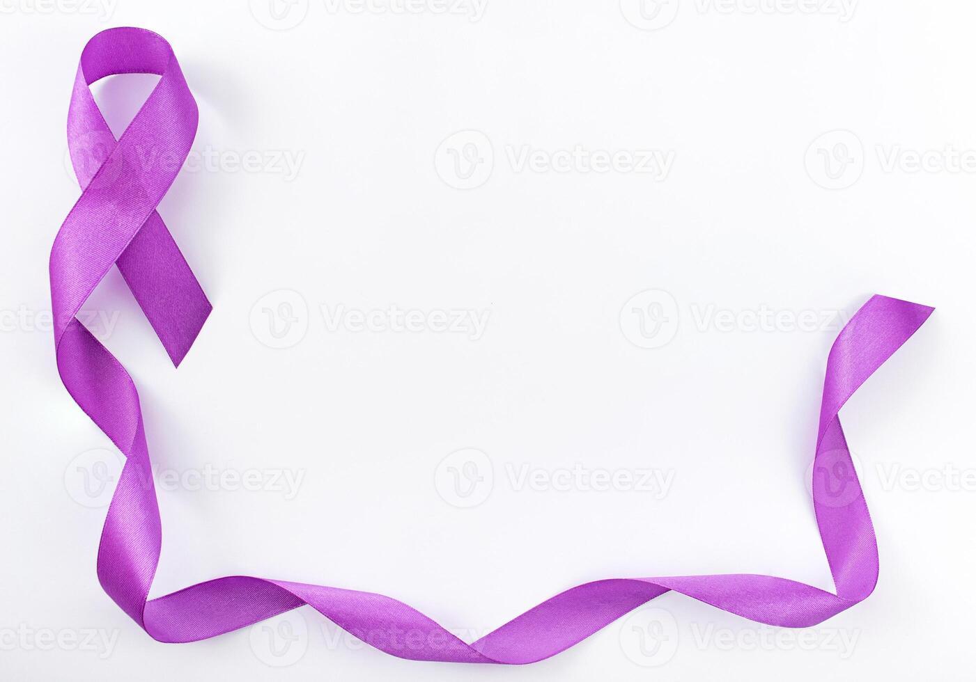 World Cancer Day. Purple ribbon on gray background with copy space for text. Cancer ribbon. photo