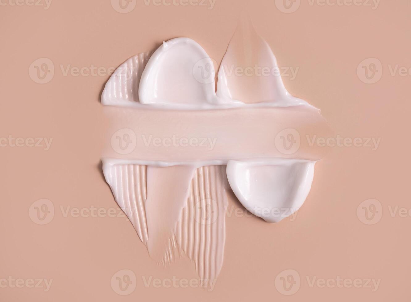 Cosmetic smear of cream texture on a beige background. Skin care. Copy space. photo