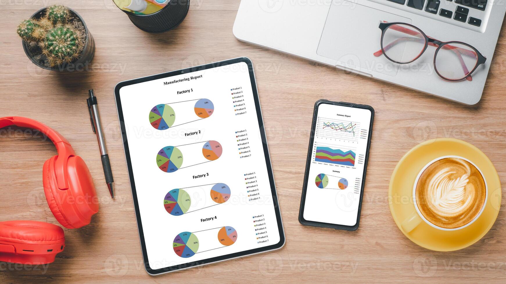 Office desk workplace with charts and reports on screen tablet and smart phone. Top view flat lay. photo