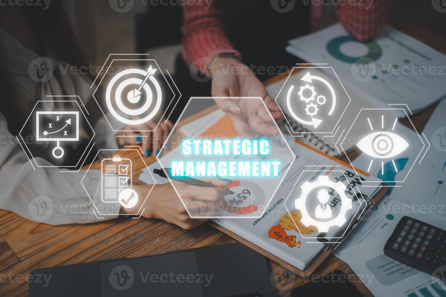 Strategic management concept. Business team analysis summary graph reports of business operating expenses and work data on desk with Strategic management icon on virtual screen. photo