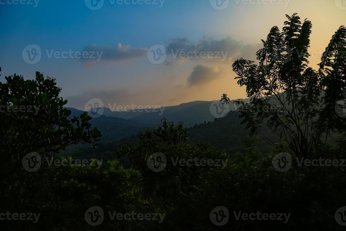 Breathtaking summer sunrise view  over the mountains with beautiful lake, kerala nature scenery image for travel and tourism concept photo