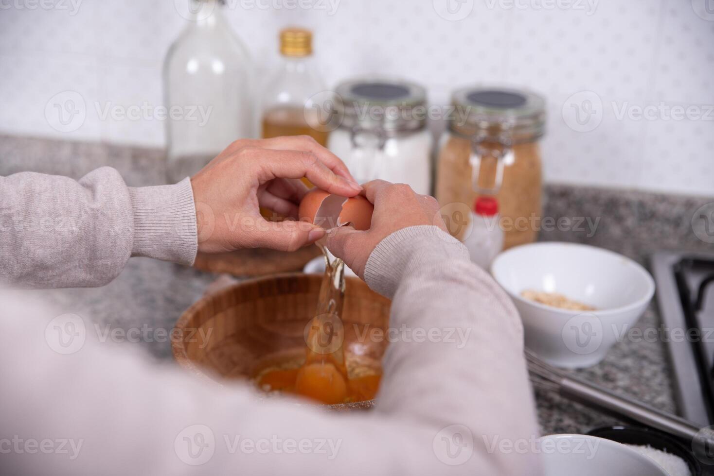 Hands pouring ingredients to make cookies at home. photo