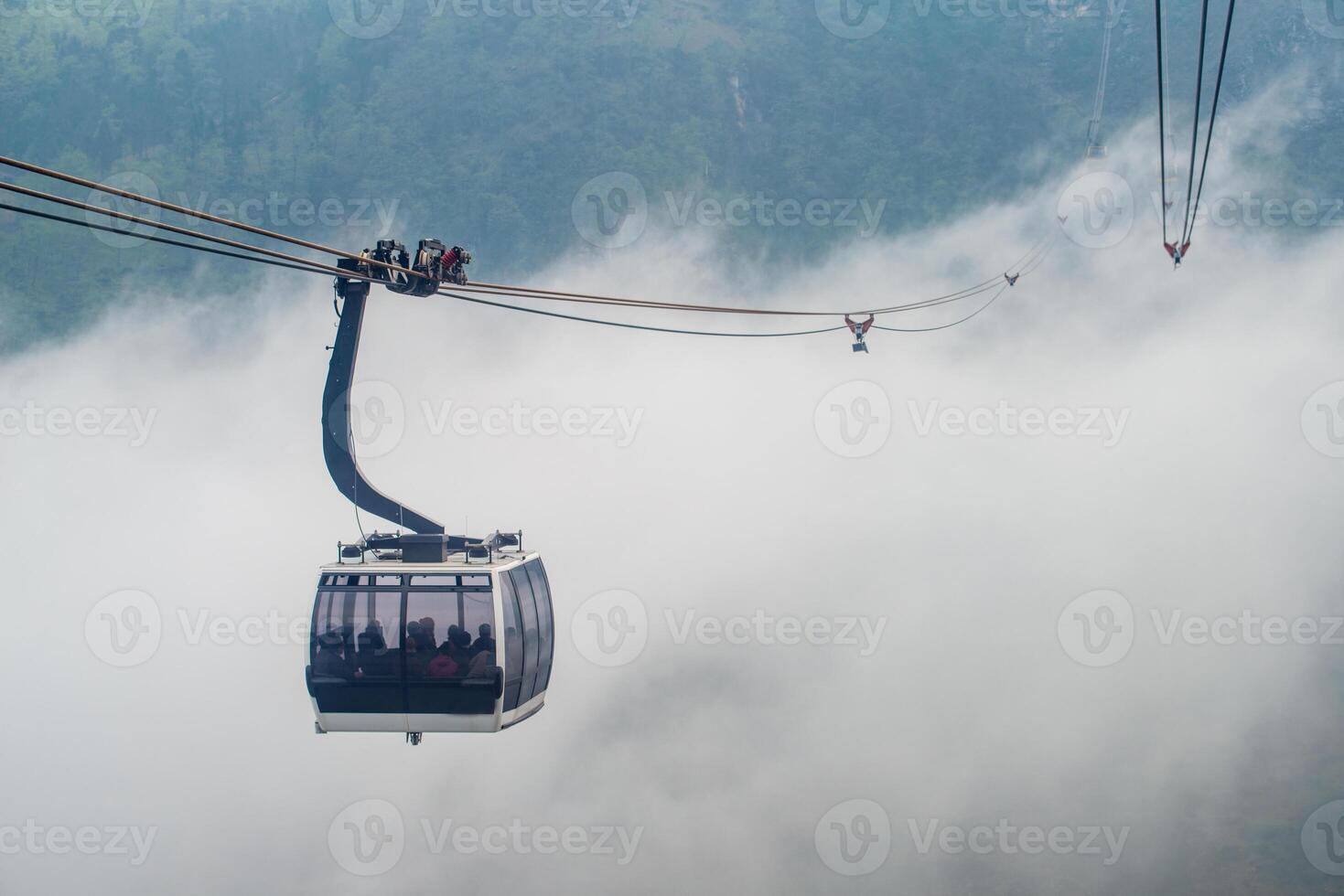 Cable car carrying passengers to Fansipan 3,143 m mountain the highest mountains peak in Vietnam. This is the world's longest electric cable car. photo