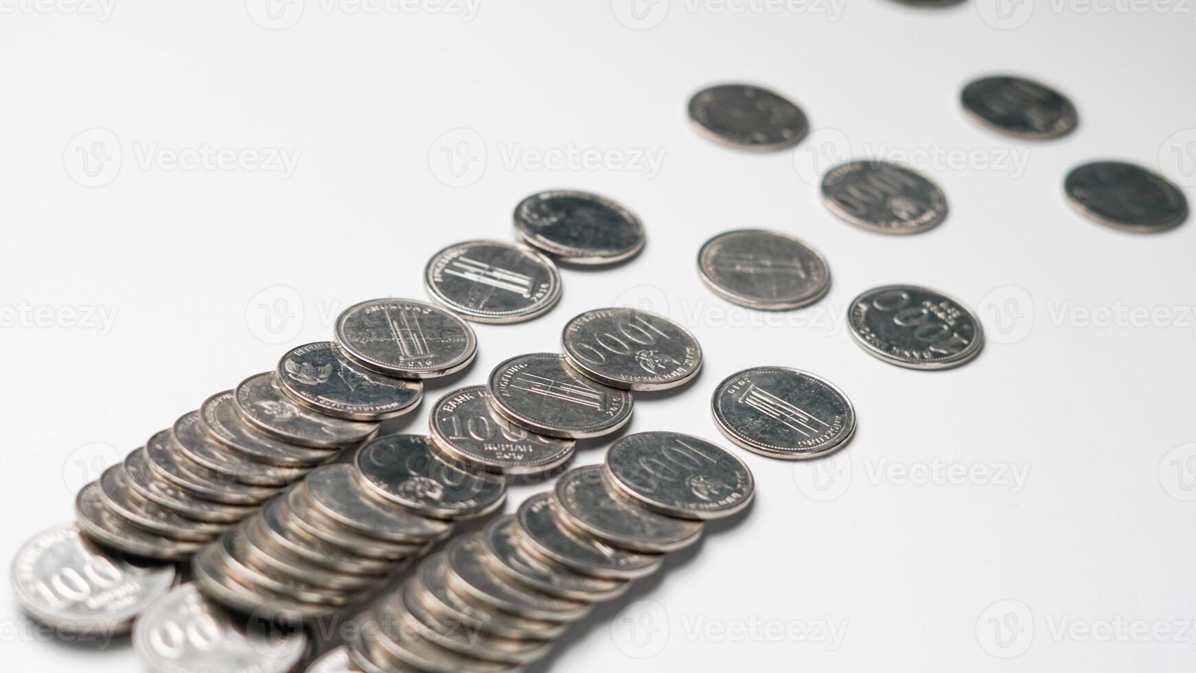 collection of Indonesian rupiah coins on a white background photo