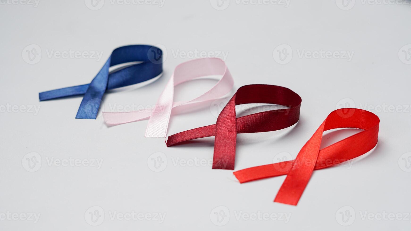 Colorful ribbons on white background, World Cancer Day photo