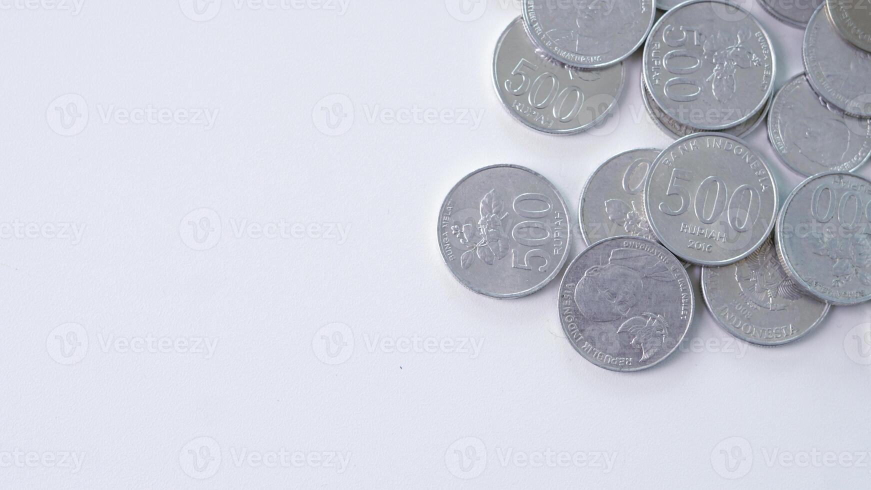 collection of Indonesian rupiah coins on a white background. photo