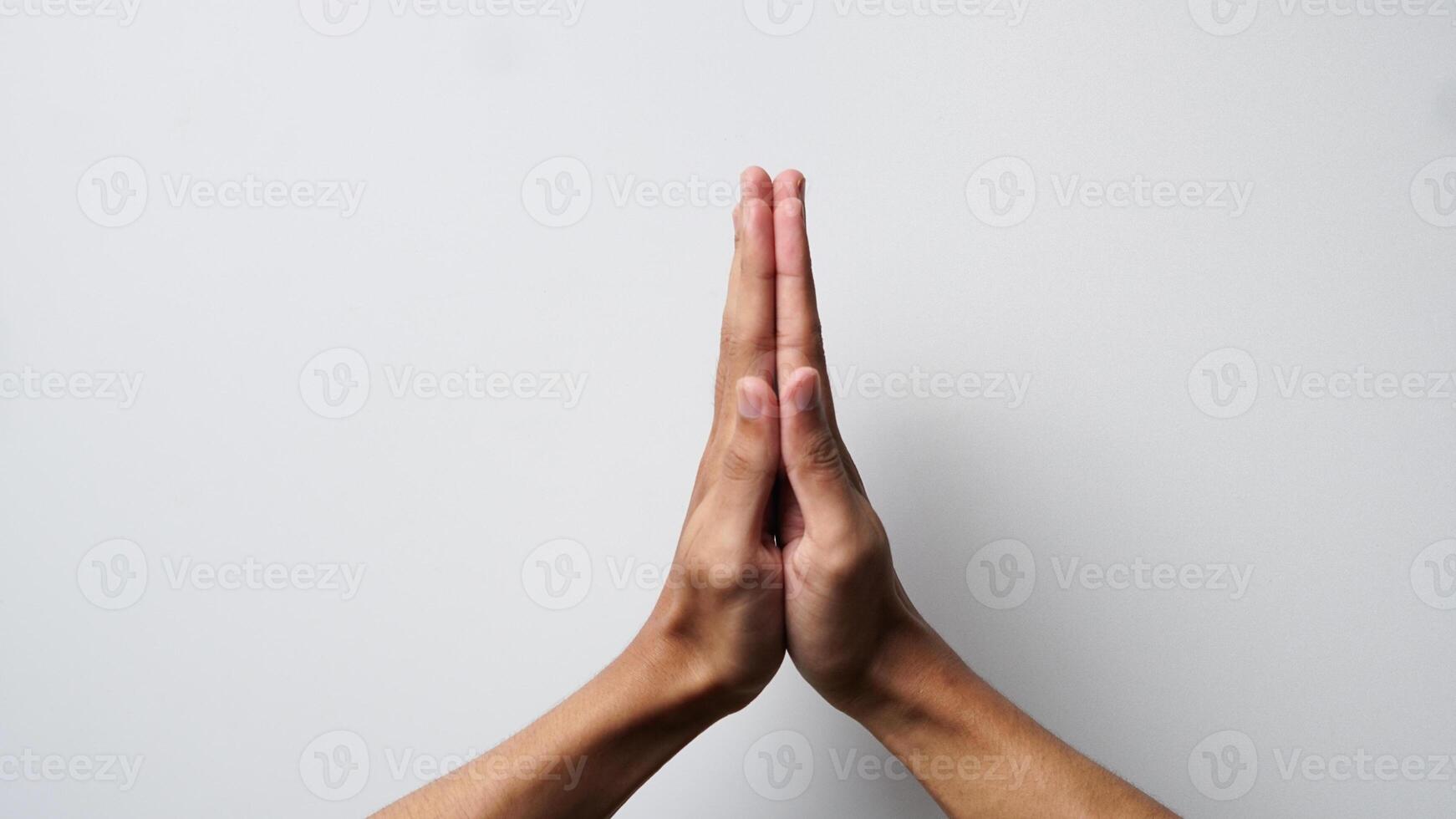 man's hand with greeting or prayer gesture on white background photo