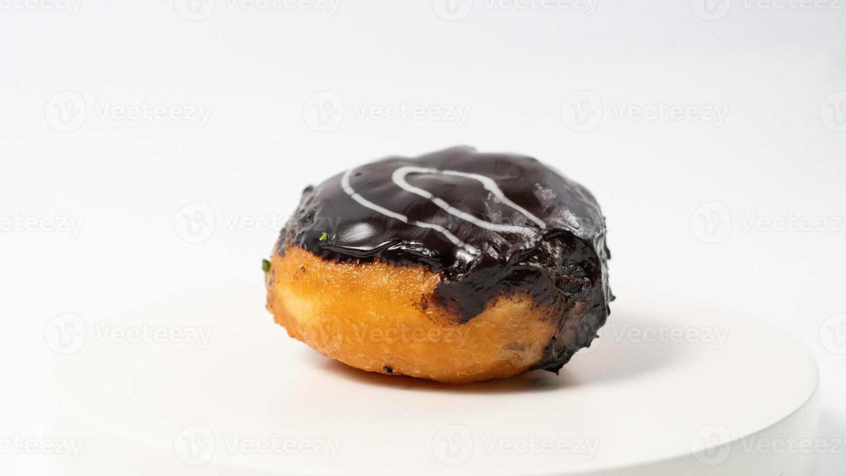 photo of donuts isolated in white background. Donuts with chocolate cream on top