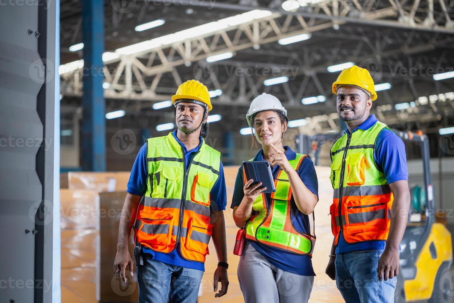 Workers team taking inventory in factory warehouse, Warehouse worker team checking containers box, Foreman workers working in warehouse talking about job photo