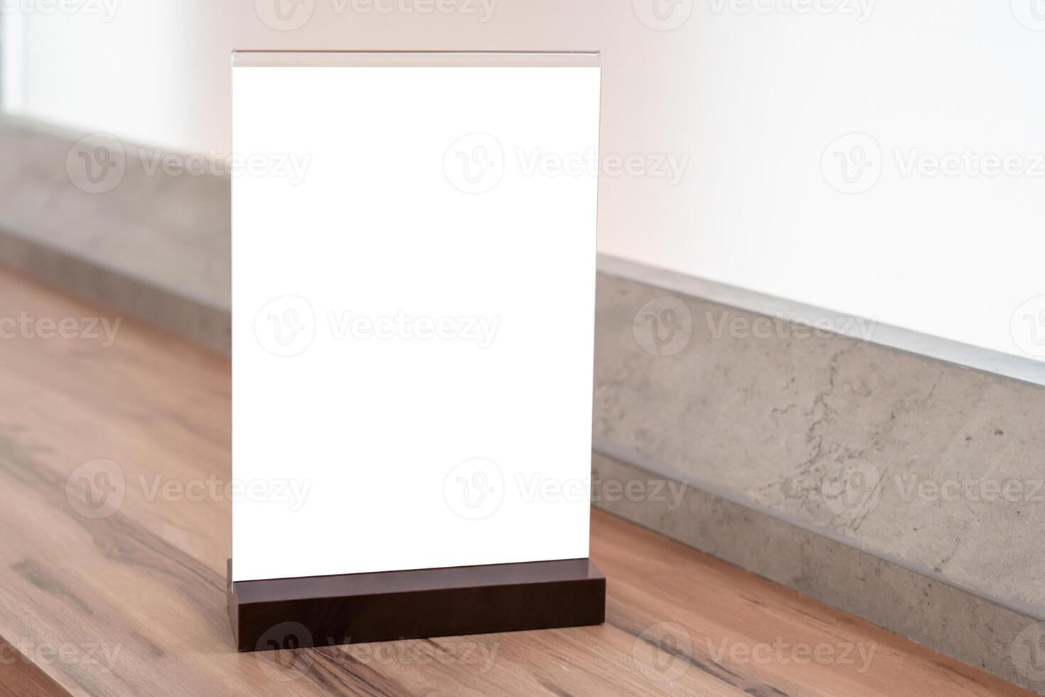 Mockup image of Blank flyer mockup plastic poster display in coffee shop photo