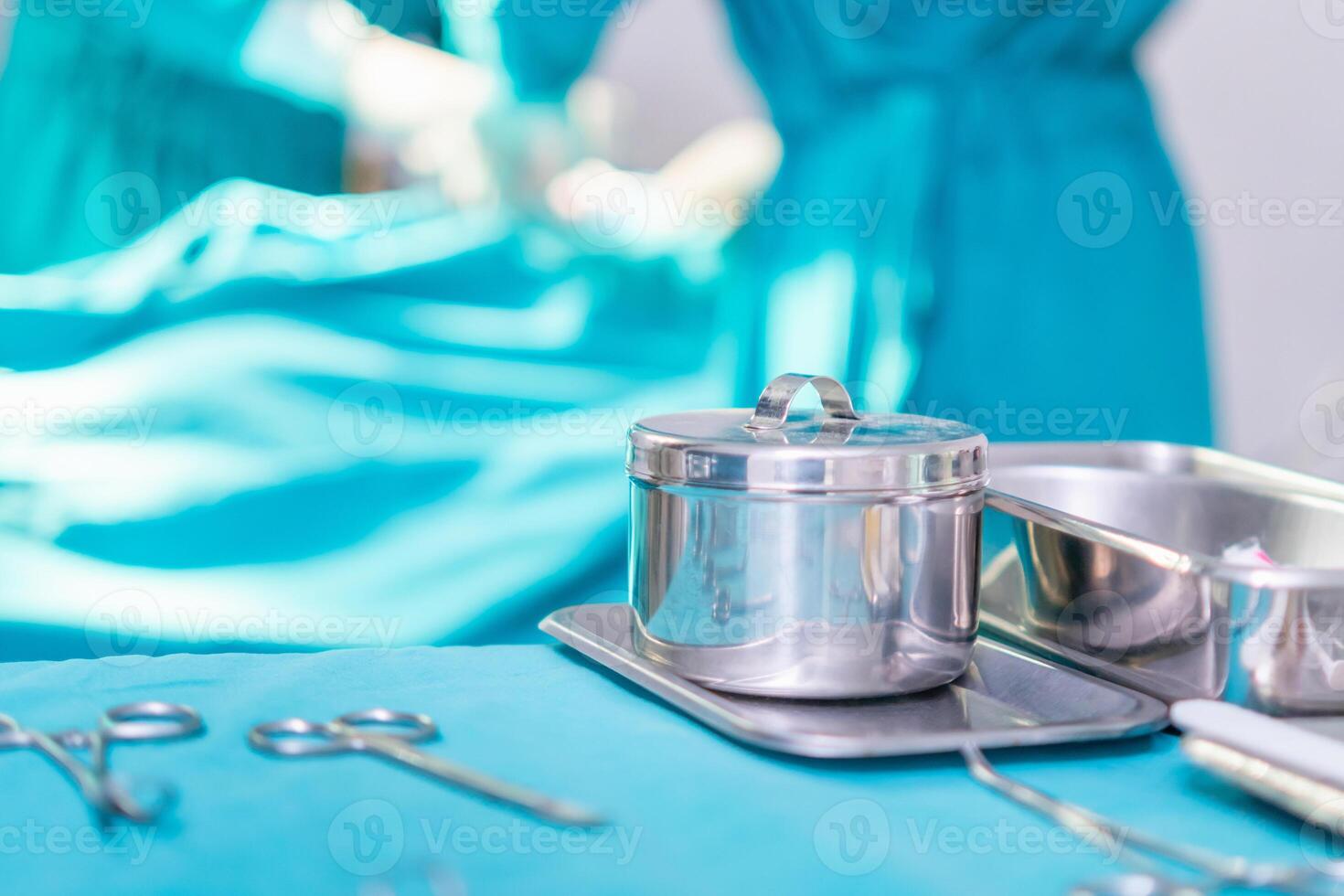 Surgical instruments and tools including scalpels, forceps, and tweezers arranged on a table for surgery, operating room with surgery equipment, preparing medical instruments for operation photo