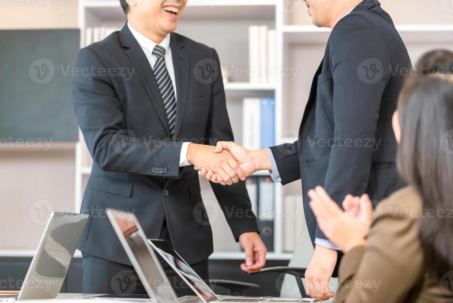 Success and happiness teamwork concepts, Businessman handshake finishing up a meeting business partnership after a good deal photo