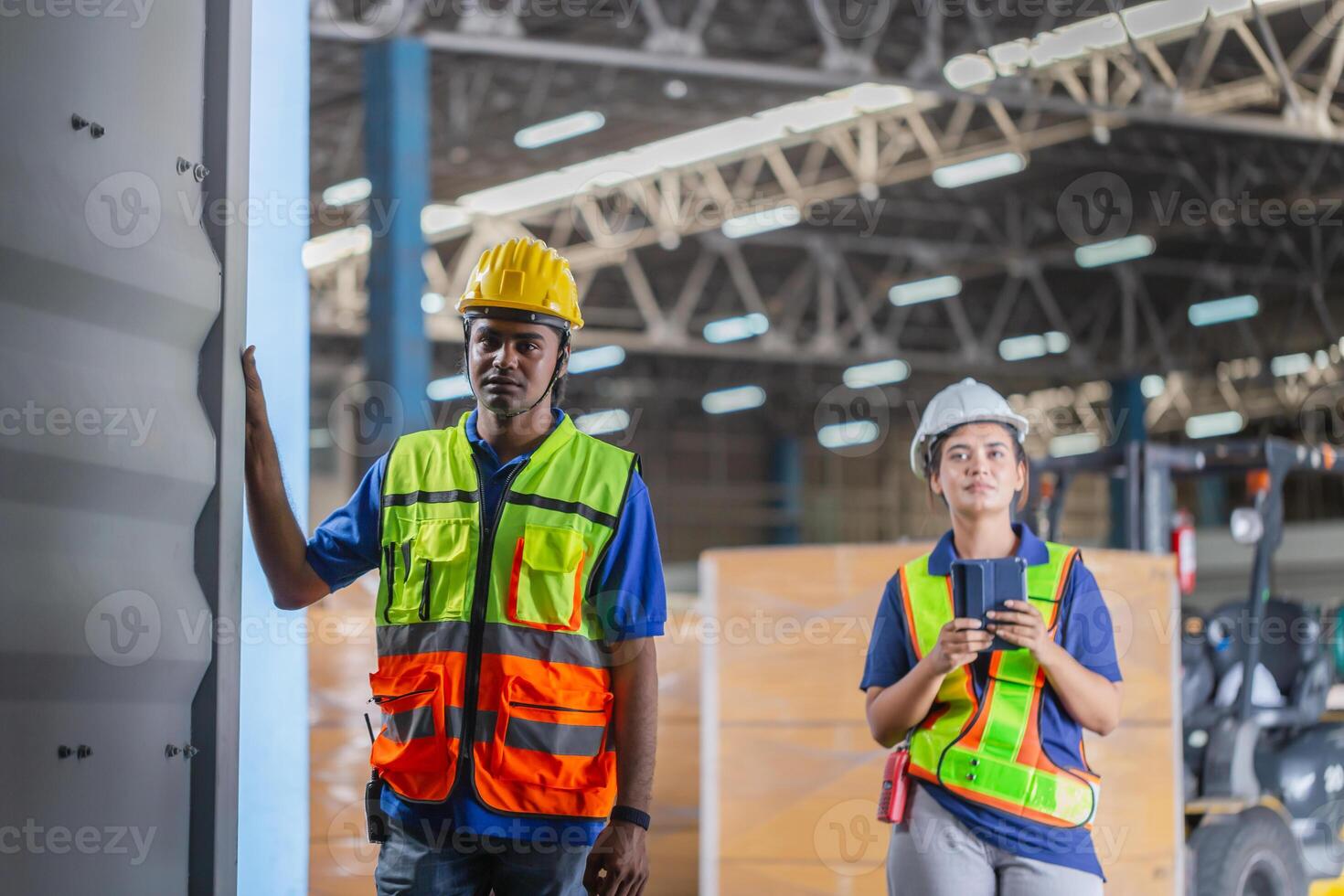 Workers team taking inventory in factory warehouse, Warehouse worker team checking containers box, Foreman workers working in warehouse talking about job photo