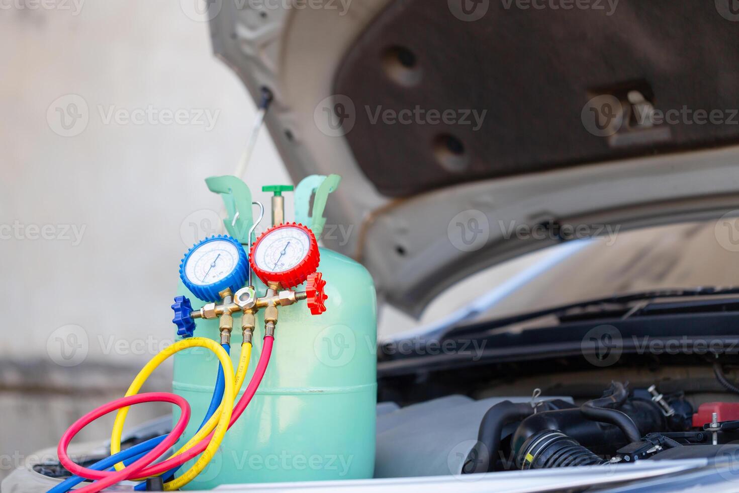 Manifold tool gauge and bucket refrigerant applies to car air conditioning, monitor tool to check and fix car air conditioner system, Car Air Conditioning Repair photo