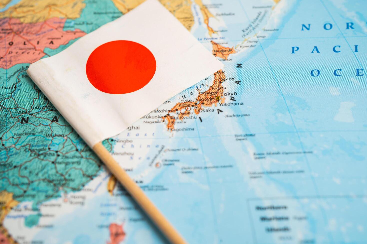 Bangkok, Thailand December 7, 2023, Japan flag on world map background. photo