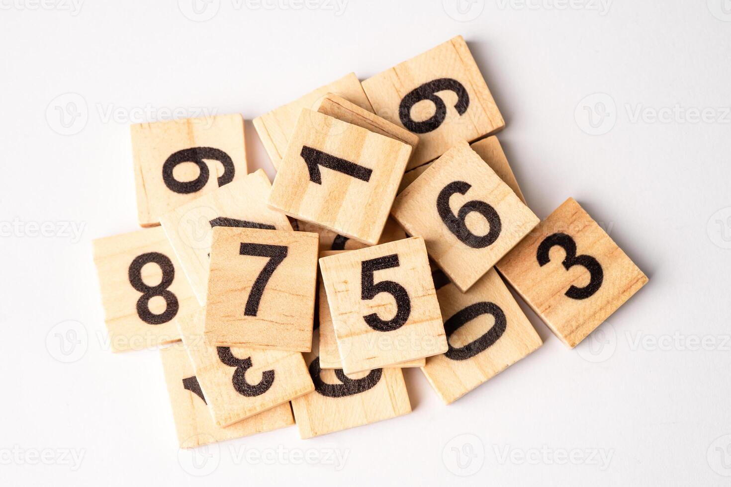Math number wooden on white background, education study mathematics learning teach concept. photo