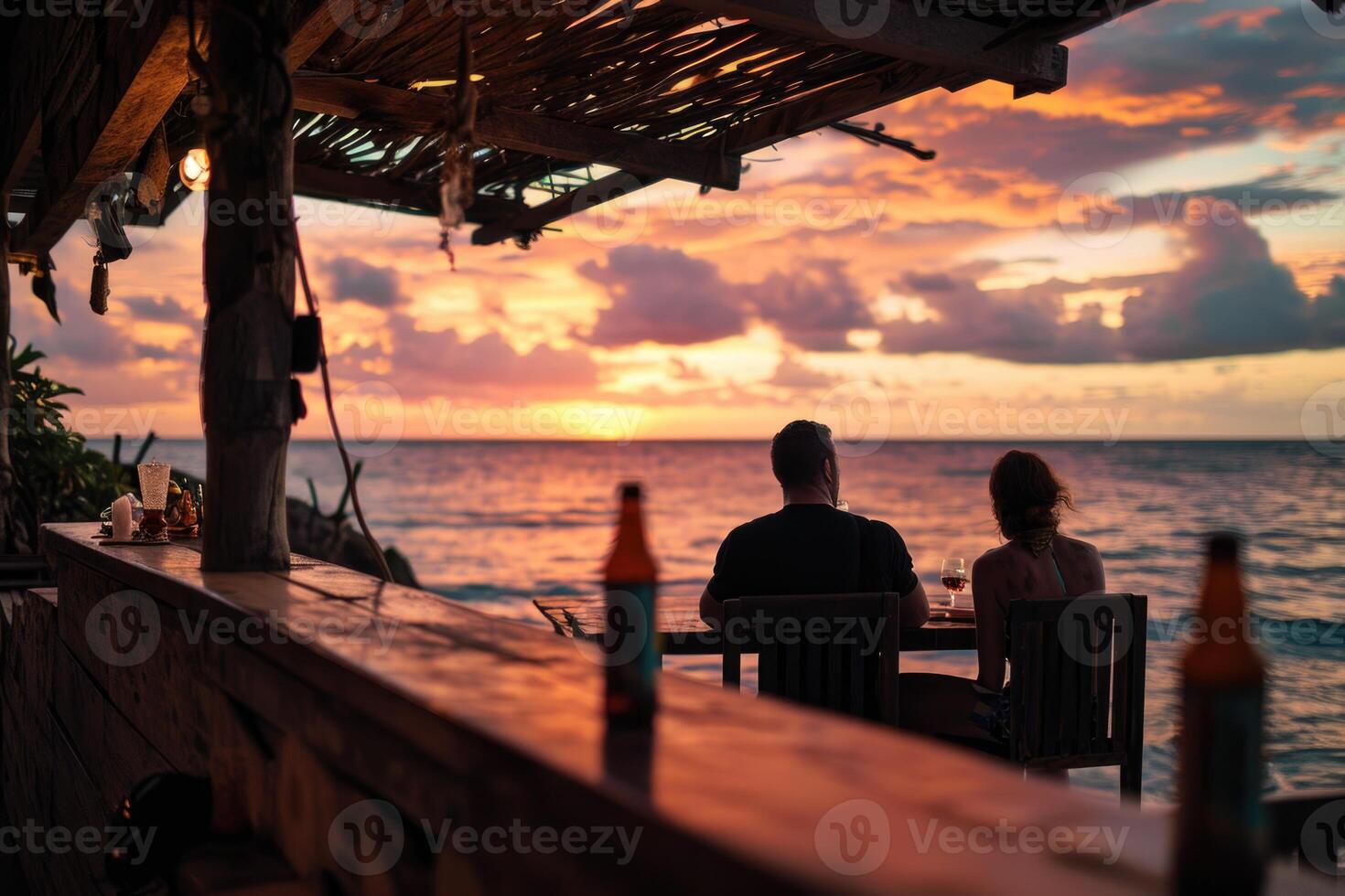 AI generated A couple drinks wine in a cafe against the backdrop of a sunset at sea. Silhouettes of people photo