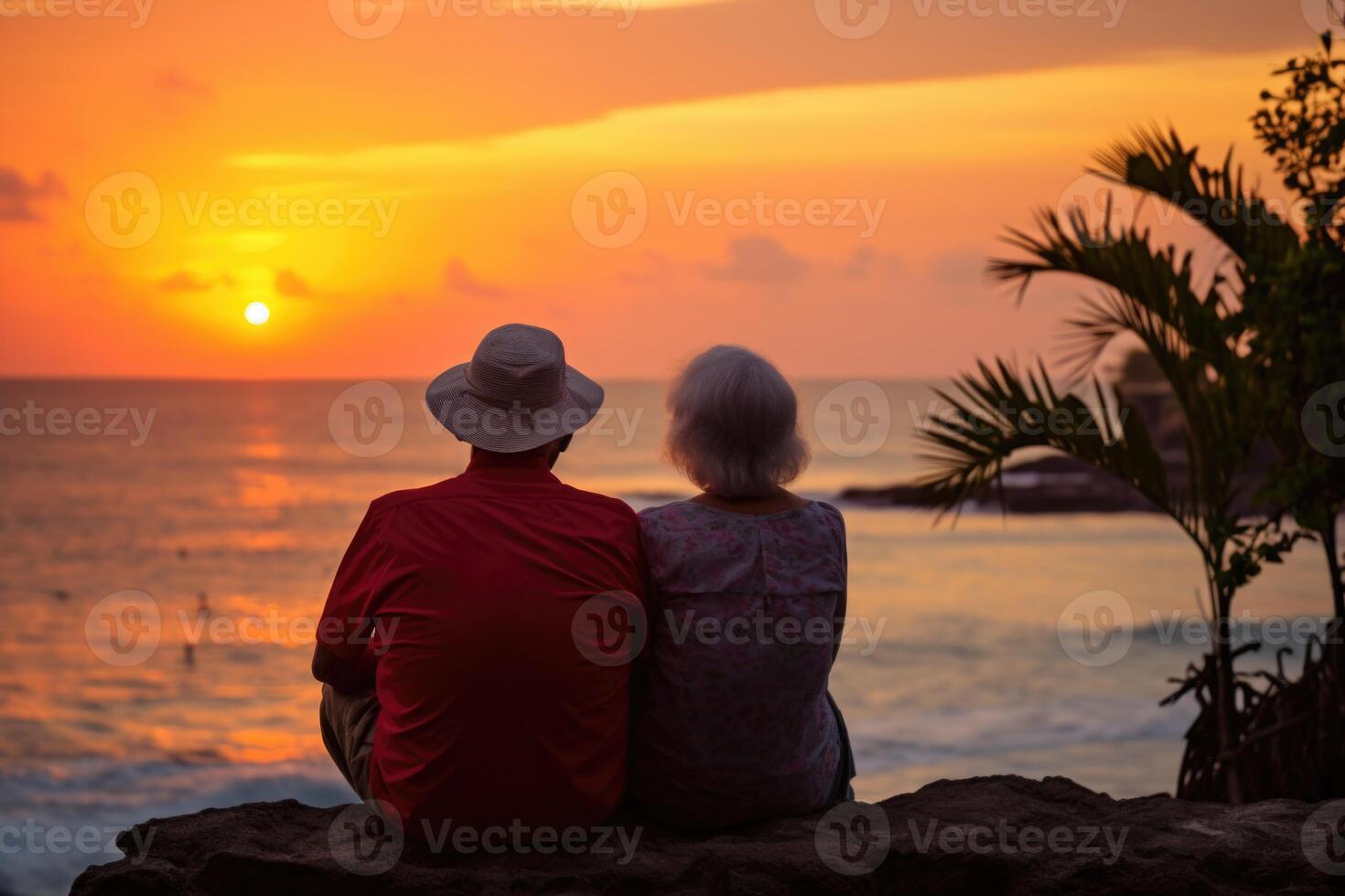 AI generated Silhouette of an elderly couple waiting for a colorful sunset sitting by the ocean photo