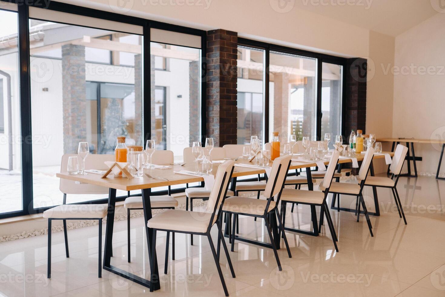 Empty dishes and cutlery on the table in the restaurant before dinner photo