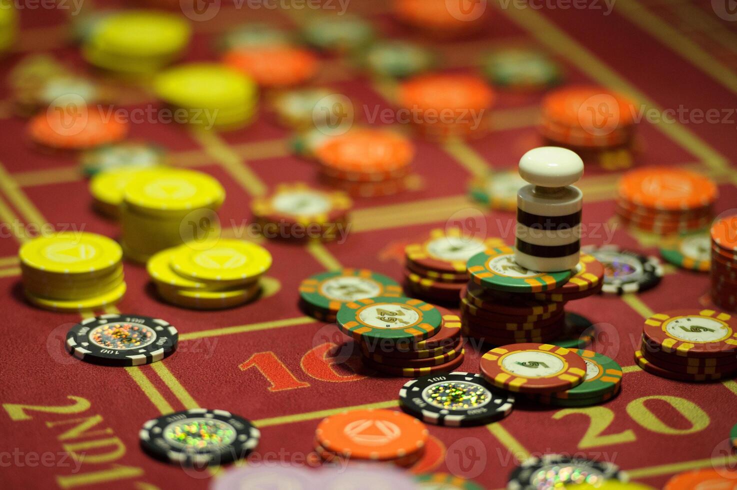 close-up of chips on the gaming table in a roulette casino photo