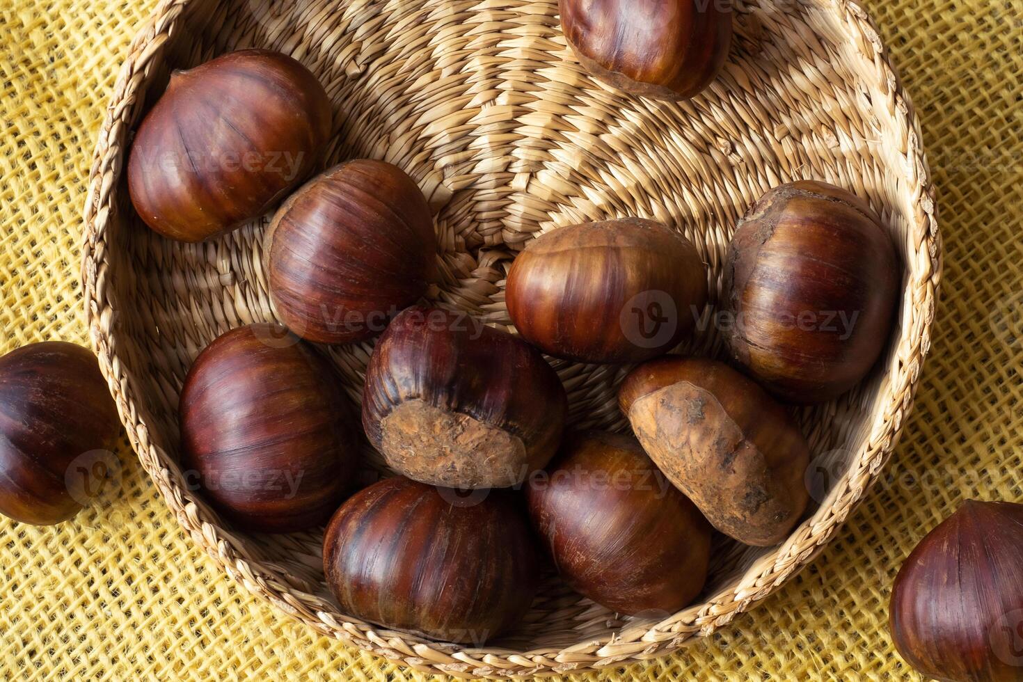 Fresh edible chestnuts in a basket photo